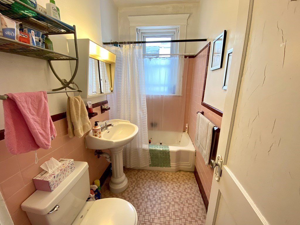 15 Parkman Street, Unit 3B Brookline, MA 02446 - Photo 12 of 15 a bathroom with a sink toilet and shower