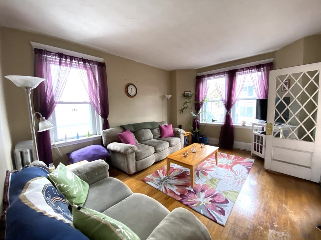 15 Parkman Street, Unit 3B Brookline, MA 02446 - Photo 13 of 15 a bedroom with furniture and a window