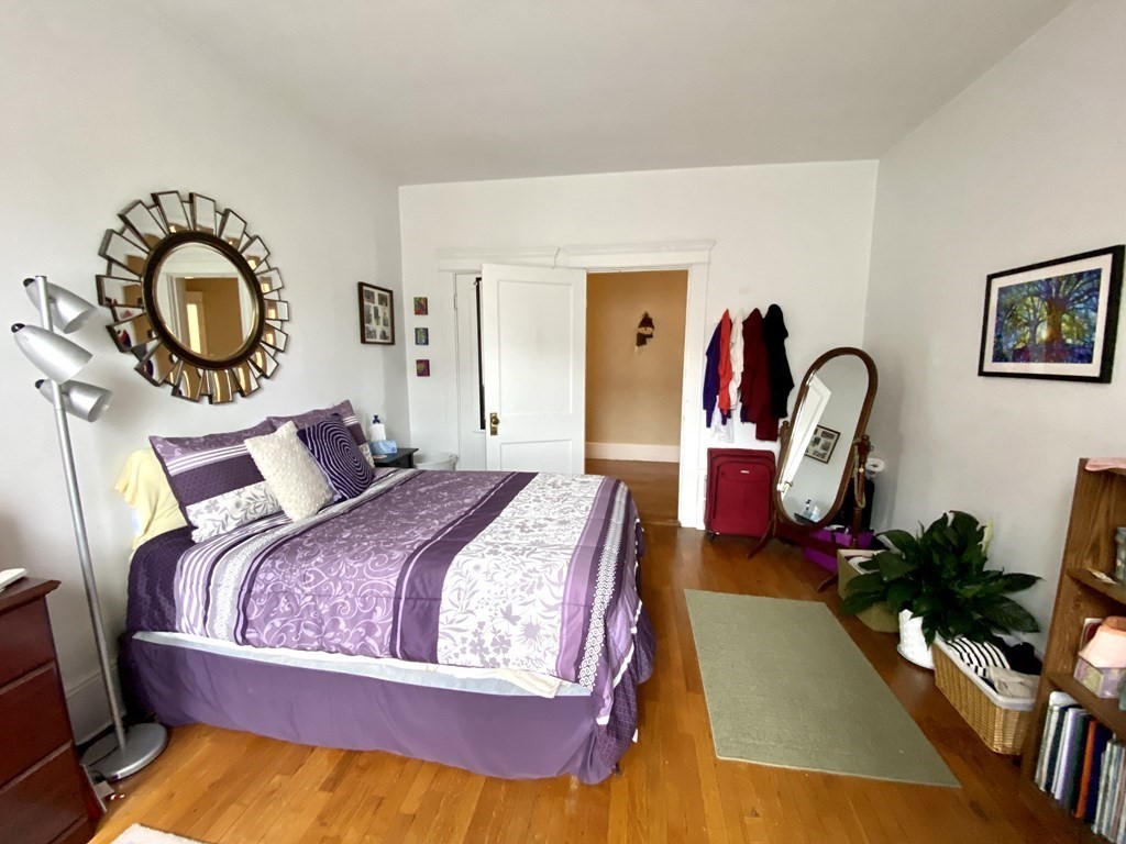 15 Parkman Street, Unit 3B Brookline, MA 02446 - Photo 3 of 15 a bed sitting in a bedroom next to a window