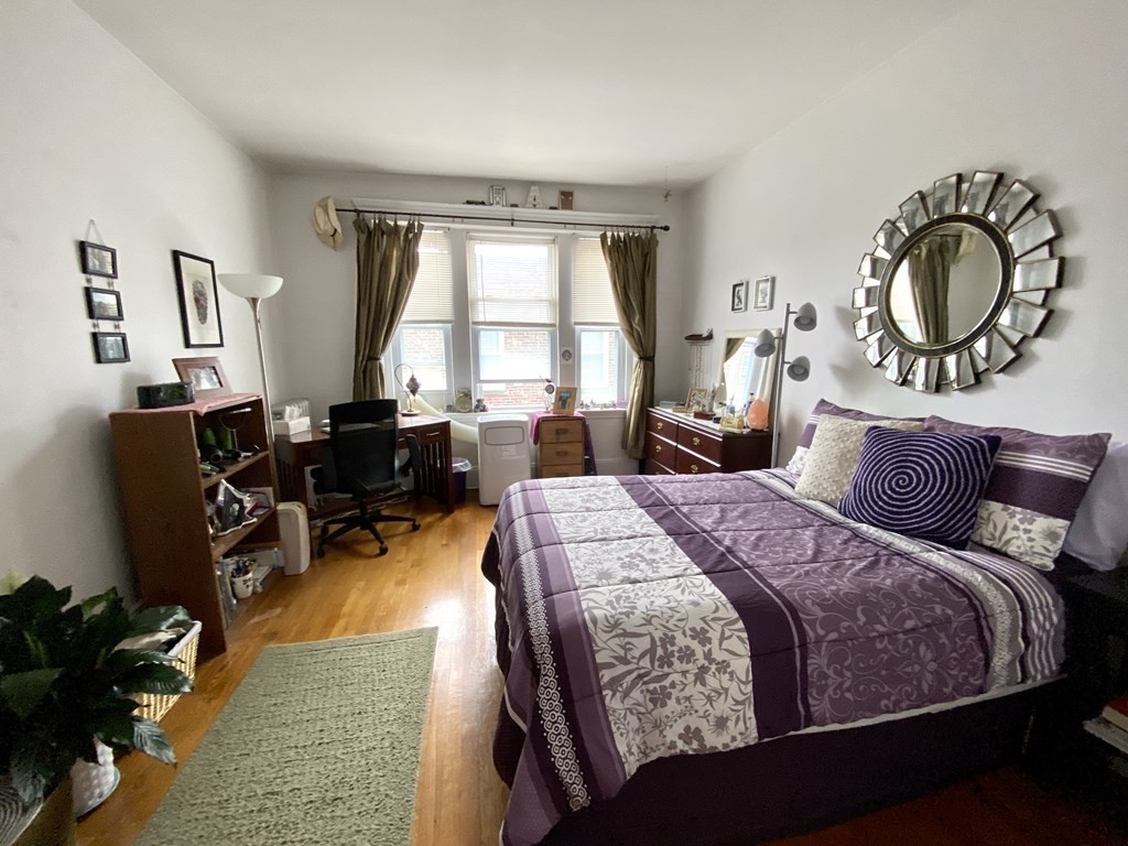 15 Parkman Street, Unit 3B Brookline, MA 02446 - Photo 4 of 15 a bedroom with bed and a large window