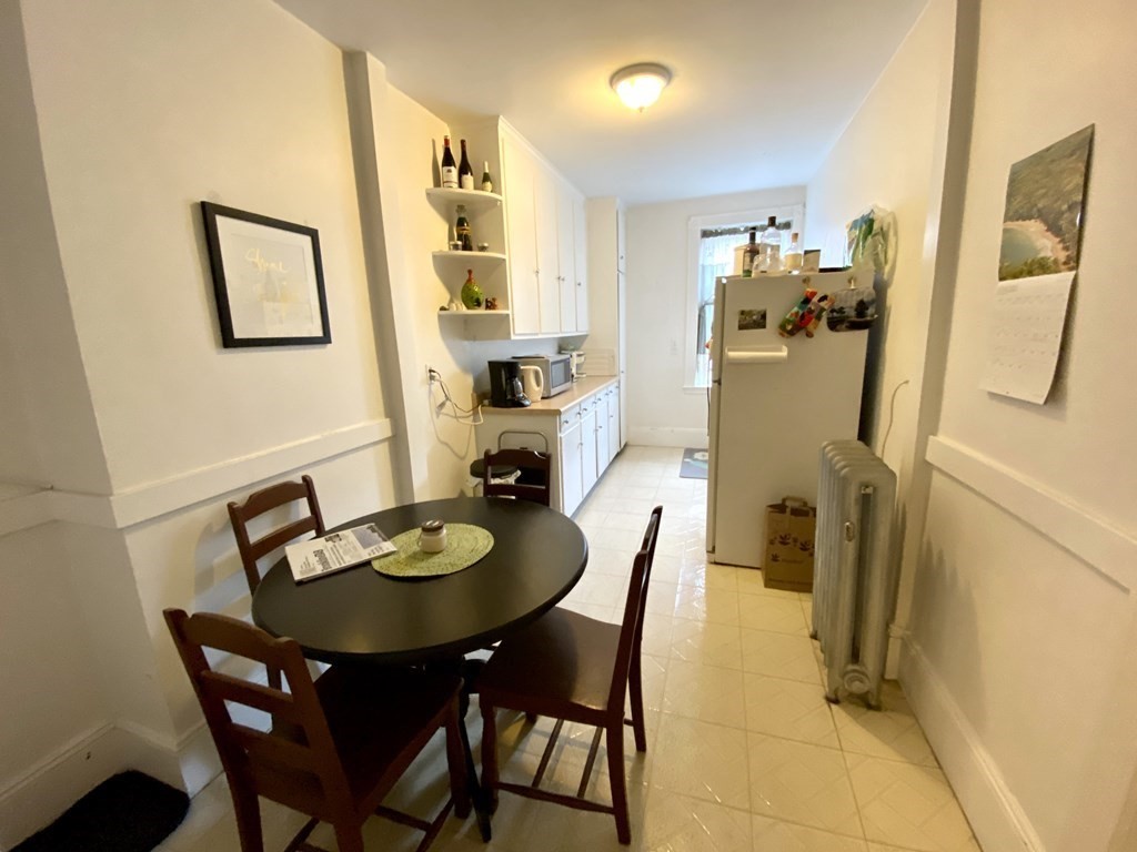 15 Parkman Street, Unit 3B Brookline, MA 02446 - Photo 9 of 15 a dining room with furniture and window