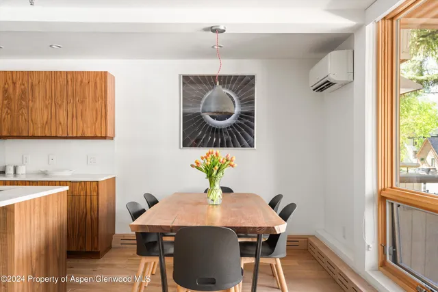 a view of a dining room with furniture window and outside view