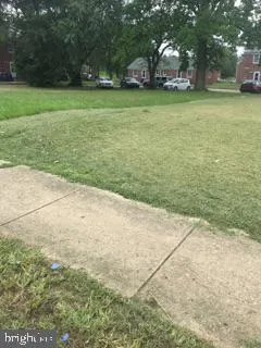 a view of a field with an trees