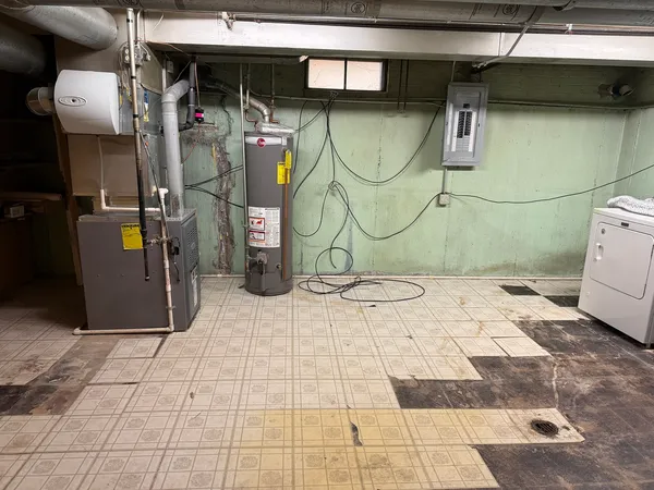a dirty bathroom with a sink