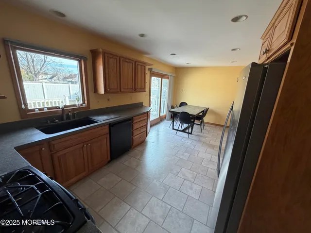 a view of kitchen with window and furniture