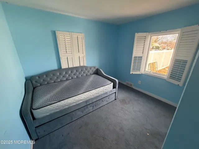 a living room with a couch and a window