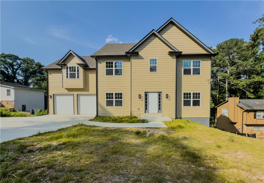 484 Fieldstream Way Northwest Lawrenceville, GA 30044 - Photo 1 of 1 a front view of a house with a yard