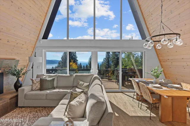 a living room with furniture and a floor to ceiling window