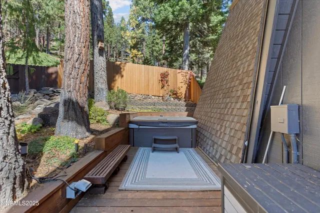 a view of balcony with wooden floor and outdoor seating