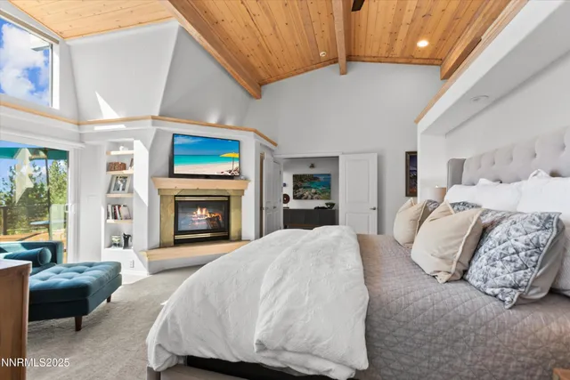 a spacious bedroom with a bed and a couch