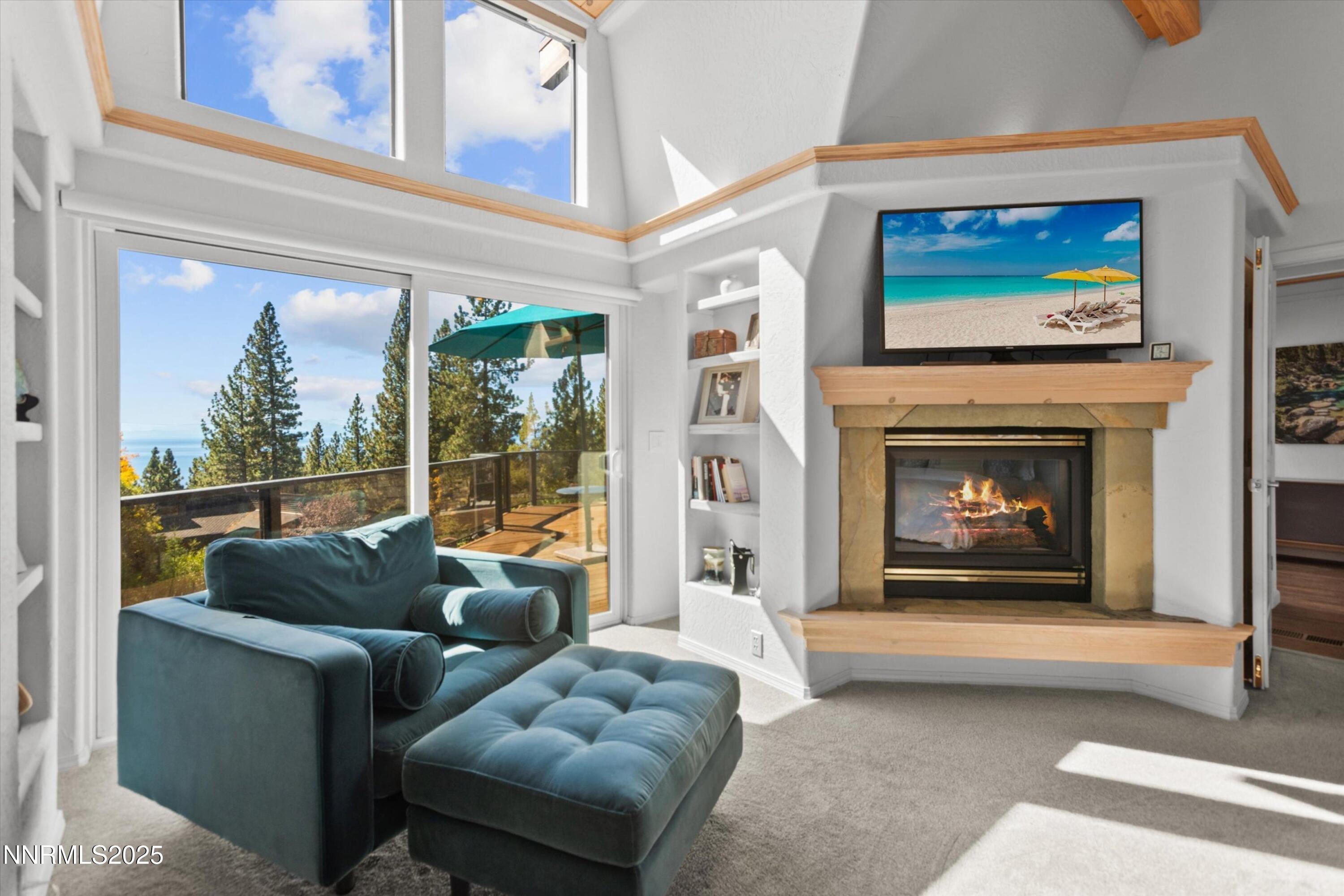 456 Jill Court Incline Village, NV 89451 - Photo 20 of 38 a living room with furniture a floor to ceiling window and a fireplace