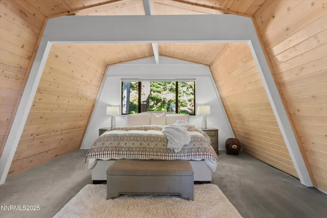 a bedroom with bed and window