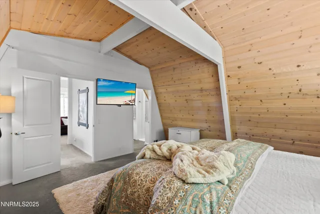 a bedroom with a bed and a rug