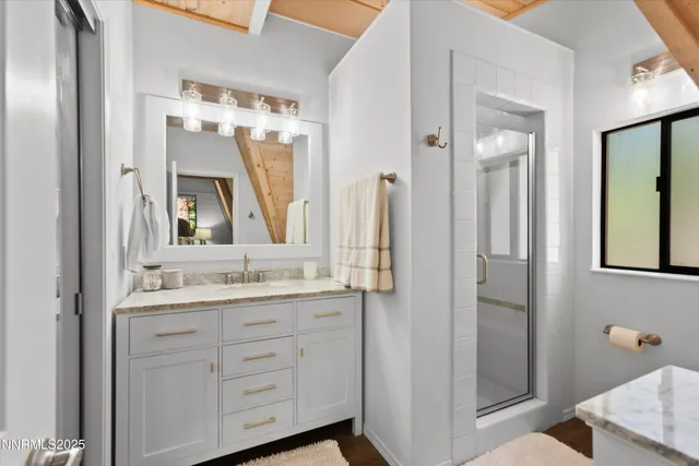 a bathroom with a double vanity sink mirror and double