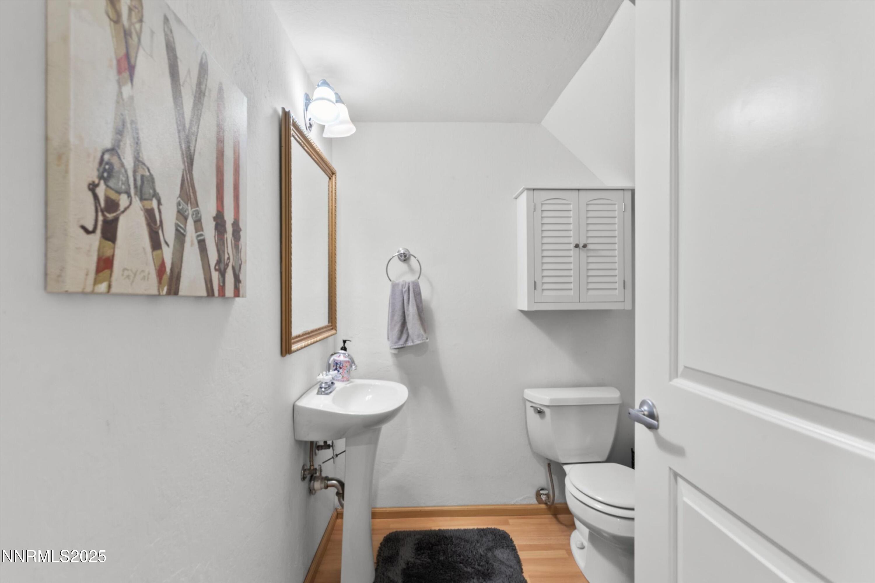 456 Jill Court Incline Village, NV 89451 - Photo 33 of 38 a bathroom with a toilet a sink and mirror