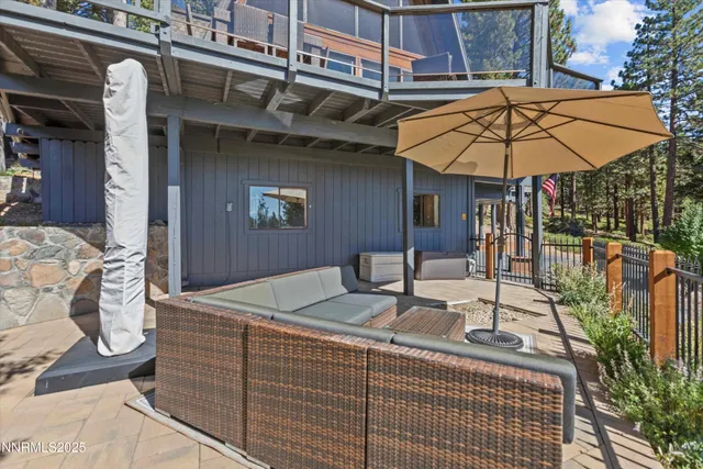 a terrace of a house with barbeque oven table and chairs