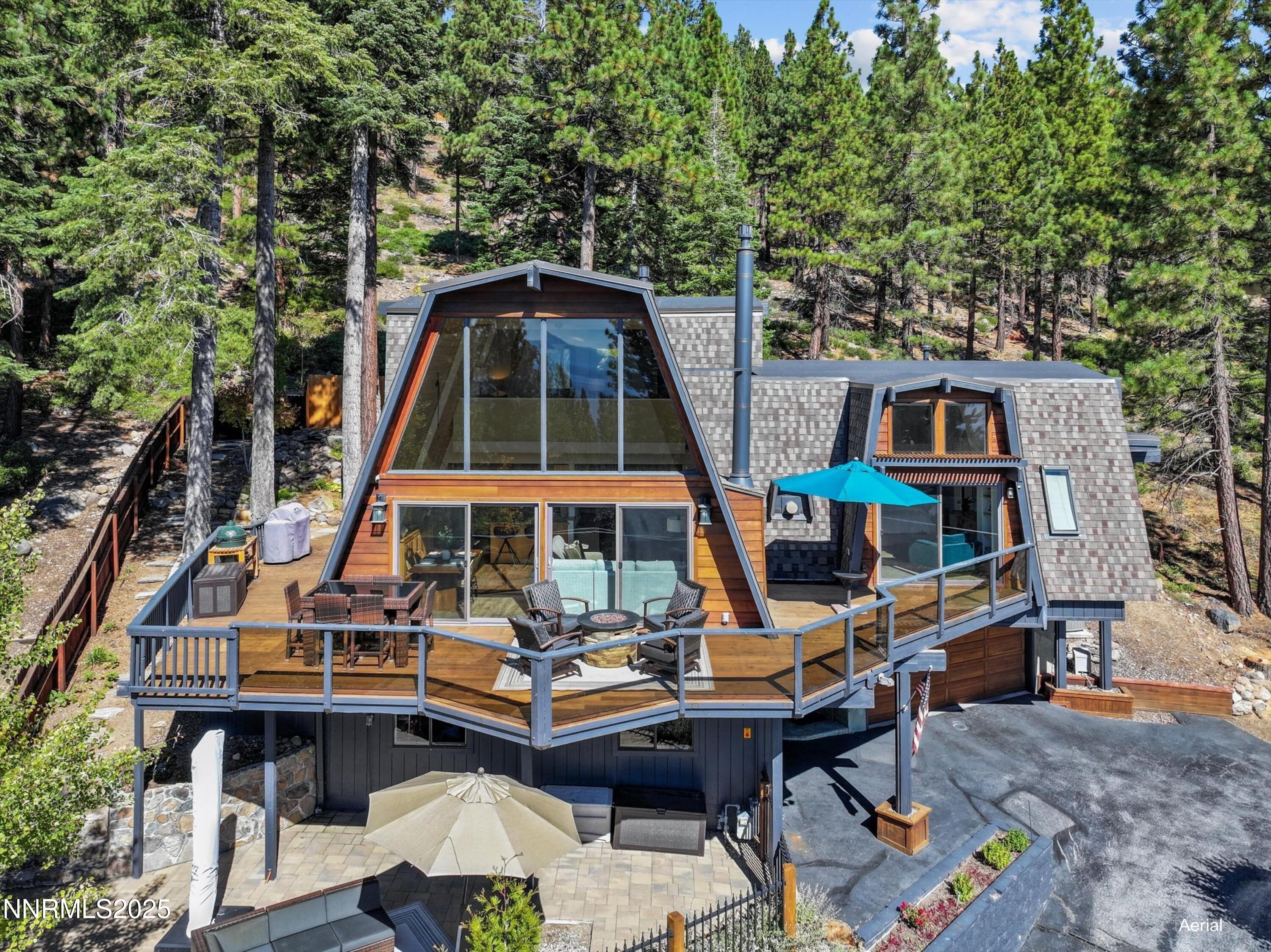 456 Jill Court Incline Village, NV 89451 - Photo 38 of 38 a view of a roof deck with table and chairs with wooden floor and fence