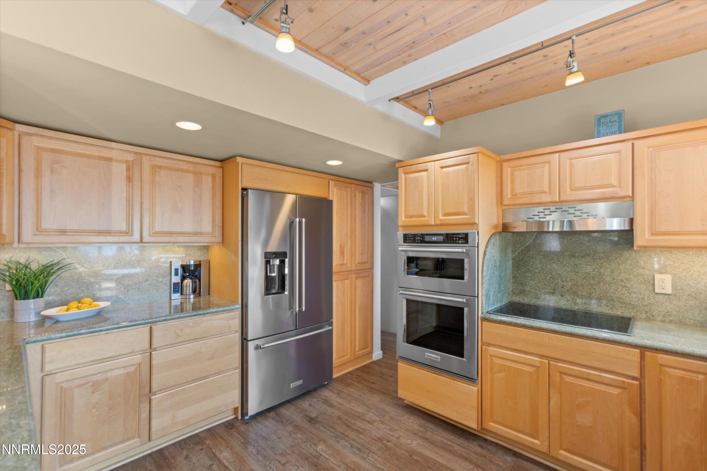 456 Jill Court Incline Village, NV 89451 - Photo 9 of 38 a kitchen with granite countertop stainless steel appliances and counter space