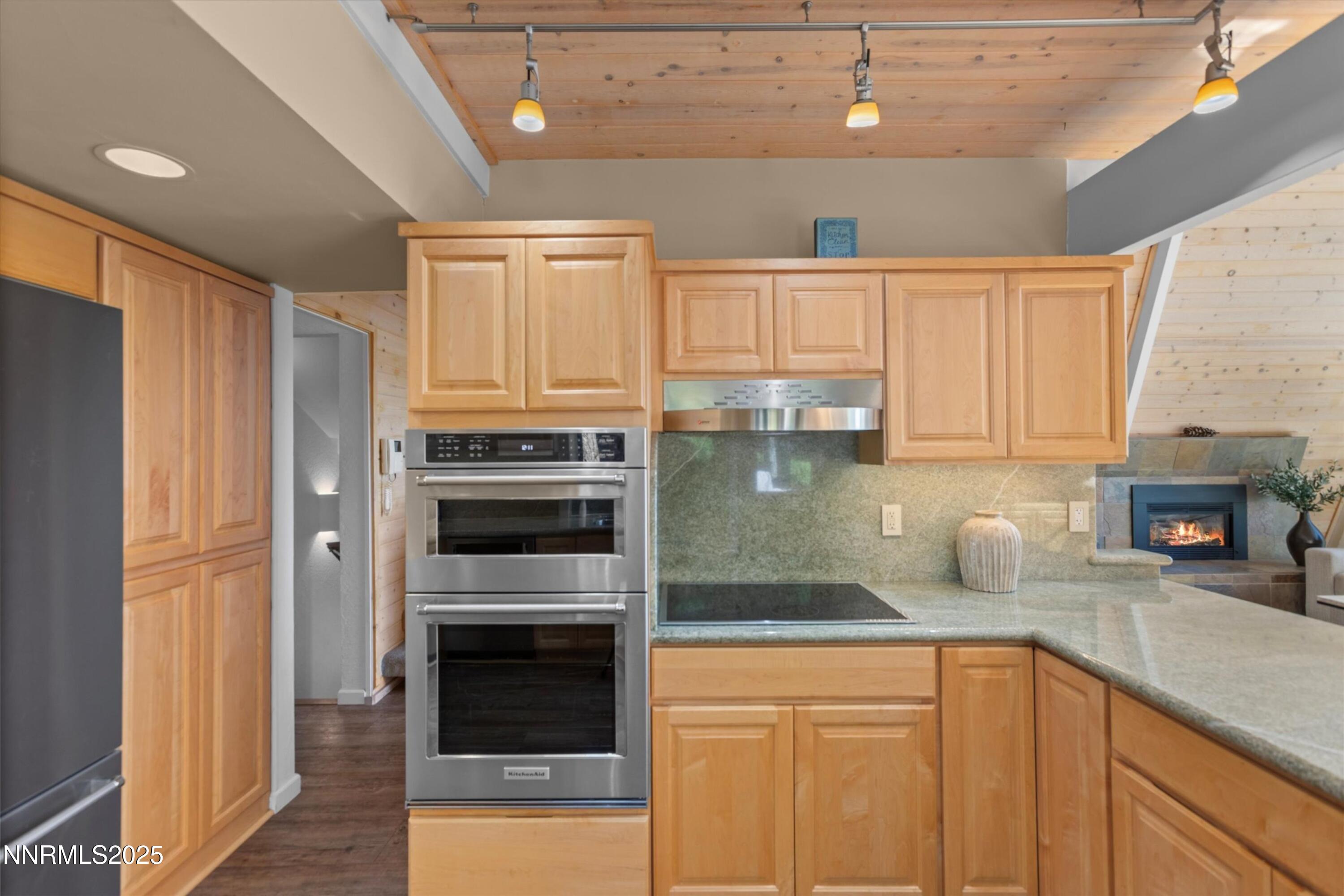 456 Jill Court Incline Village, NV 89451 - Photo 10 of 38 a kitchen with stainless steel appliances a stove a sink and cabinets
