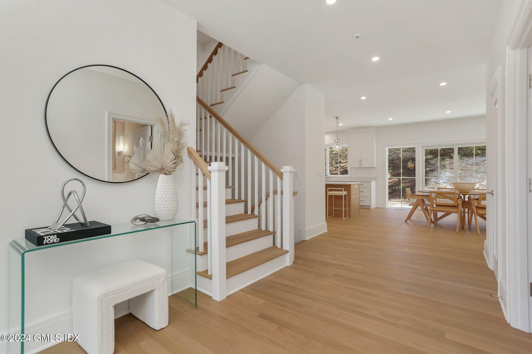 86 Mary Lane Riverside, CT 06878 - Photo 2 of 28 a view of a livingroom with furniture and stairs
