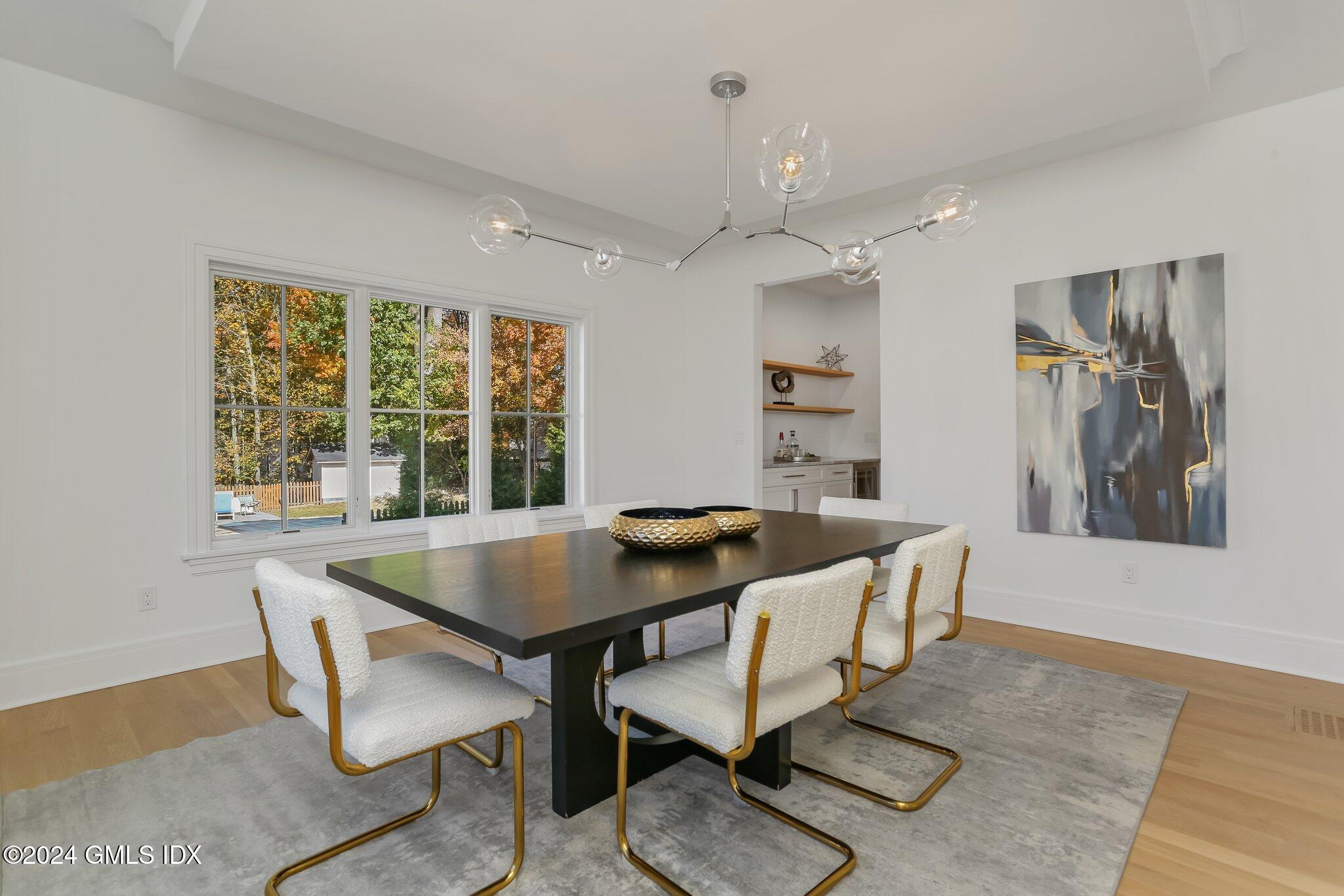 86 Mary Lane Riverside, CT 06878 - Photo 4 of 28 a view of a dining room with furniture window and wooden floor
