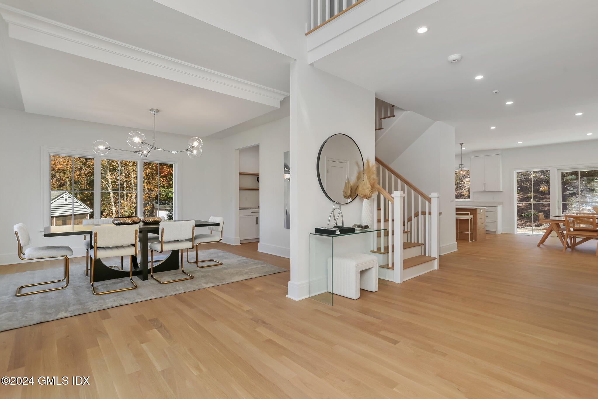 86 Mary Lane Riverside, CT 06878 - Photo 5 of 28 a living room with furniture a rug and a wooden floor
