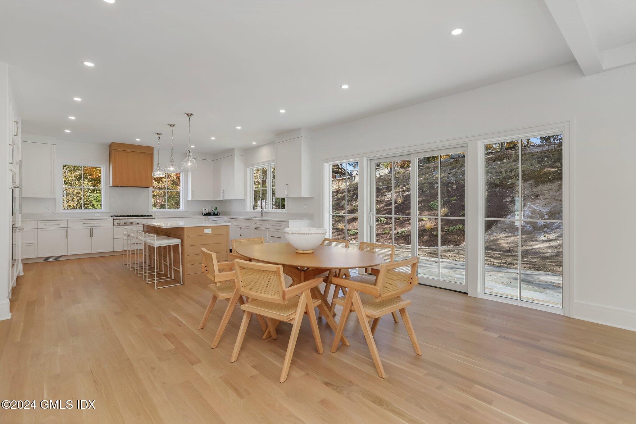 86 Mary Lane Riverside, CT 06878 - Photo 6 of 28 a dining room with furniture and wooden floor