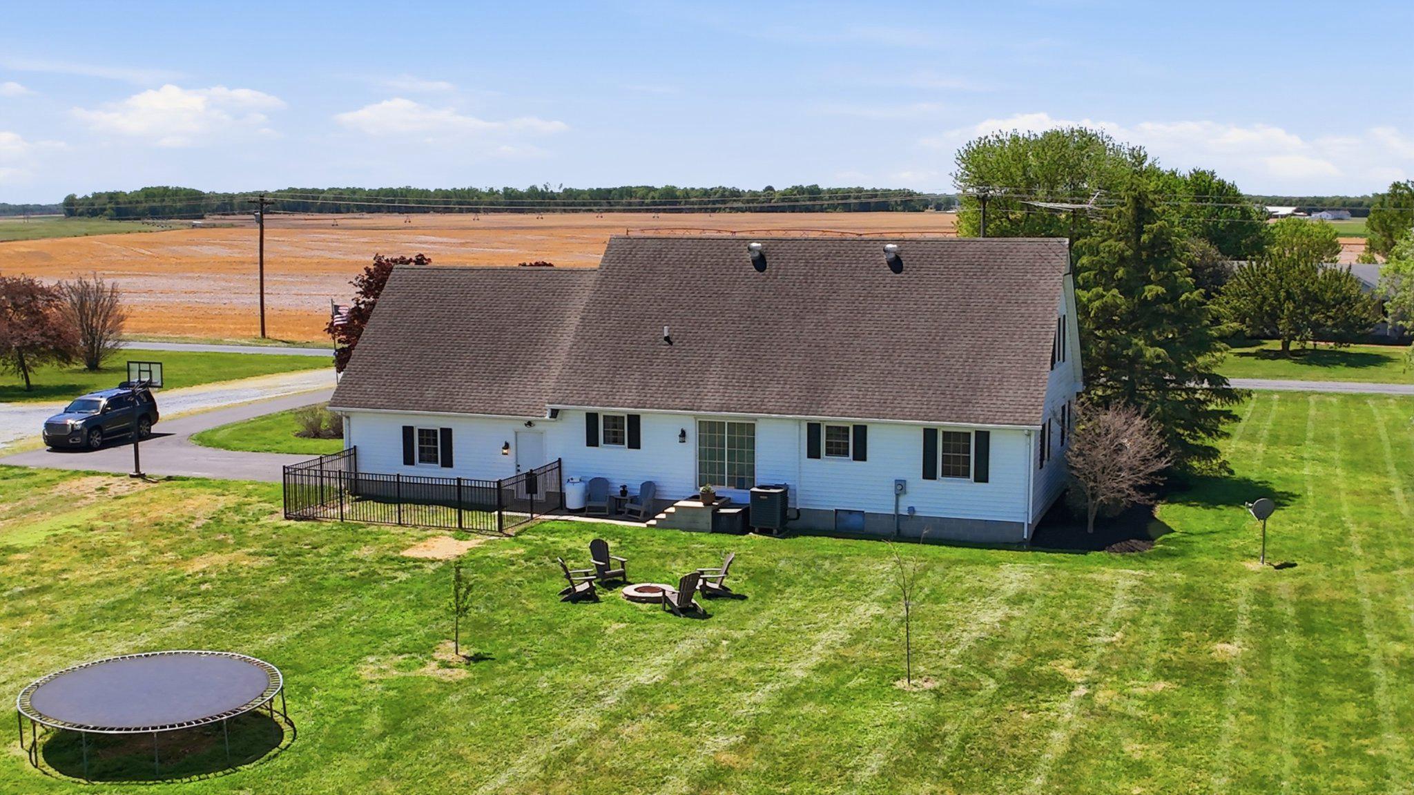 2246 Prospect Church Road Harrington, DE 19952 - Photo 35 of 47 a aerial view of a house with swimming pool and a yard