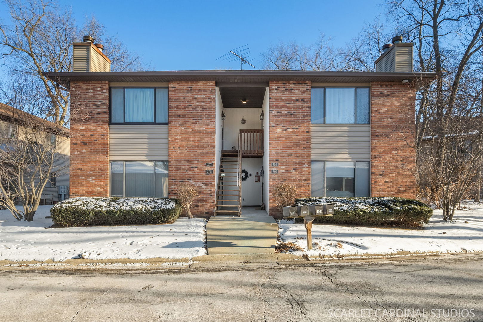 305 South Harrison Street, Unit 305 Geneva, IL 60134 - Photo 1 of 20 a front view of a house with a yard