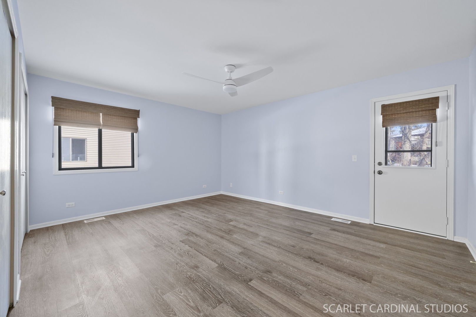 305 South Harrison Street, Unit 305 Geneva, IL 60134 - Photo 14 of 20 a view of an empty room with wooden floor and a window