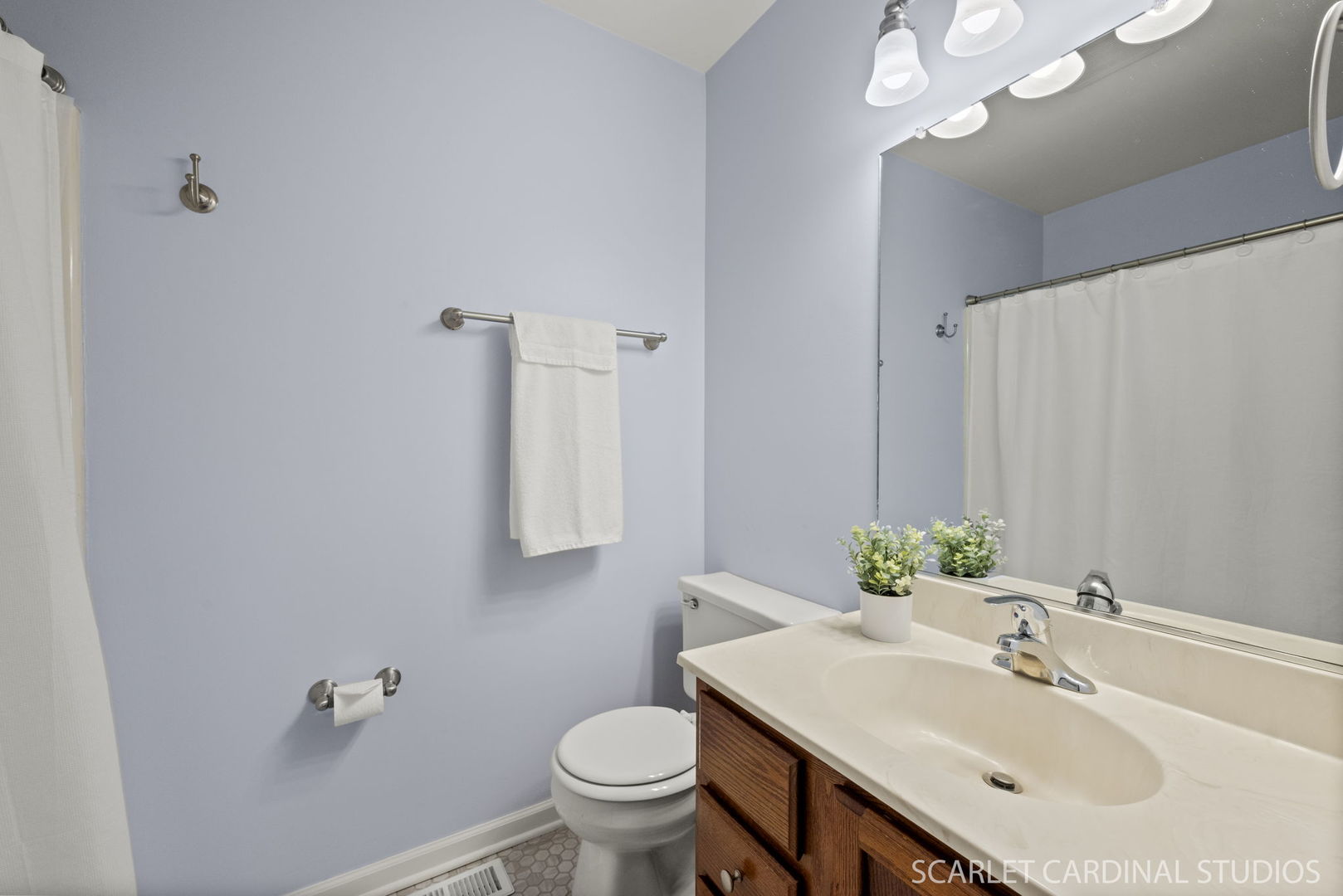 305 South Harrison Street, Unit 305 Geneva, IL 60134 - Photo 16 of 20 a bathroom with a sink vanity and a toilet