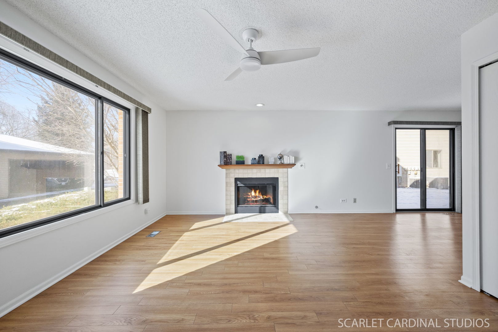 305 South Harrison Street, Unit 305 Geneva, IL 60134 - Photo 5 of 20 a view of an empty room with a window and a fireplace