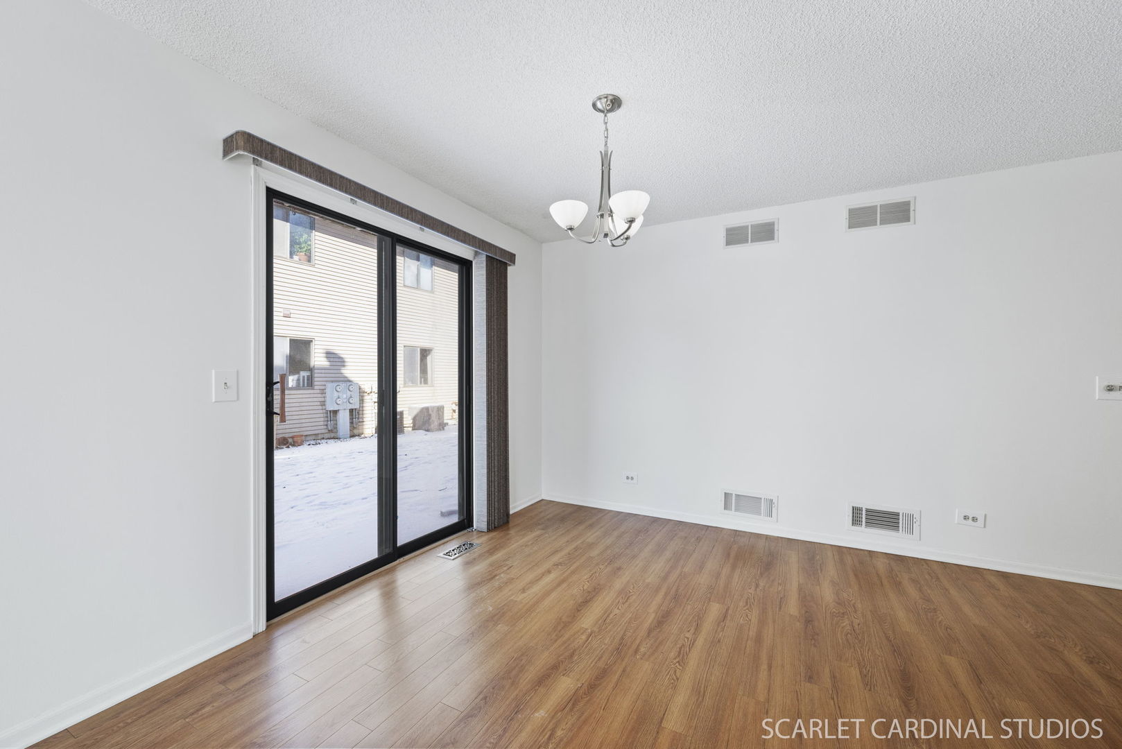 305 South Harrison Street, Unit 305 Geneva, IL 60134 - Photo 7 of 20 a view of empty room with wooden floor and fan