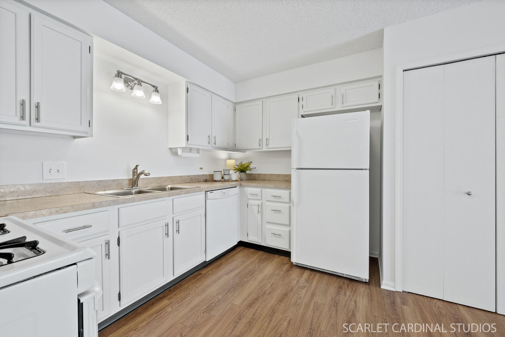 305 South Harrison Street, Unit 305 Geneva, IL 60134 - Photo 10 of 20 a kitchen with white cabinets and white appliances