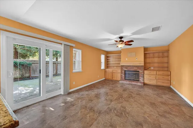 a bathroom with a granite countertop sink a toilet and a mirror