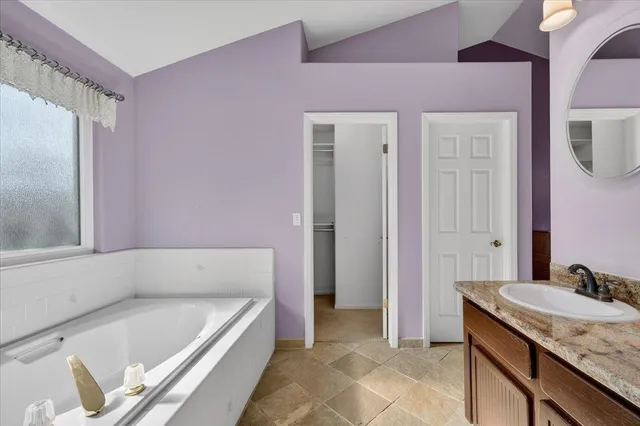 a aerial view of a house with a yard and potted plants