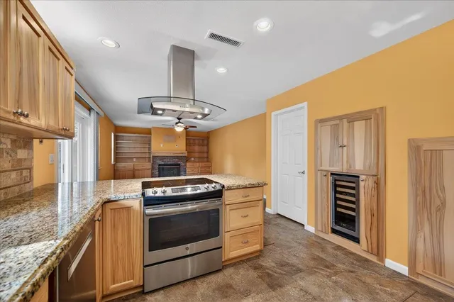 a kitchen with a stove and a refrigerator