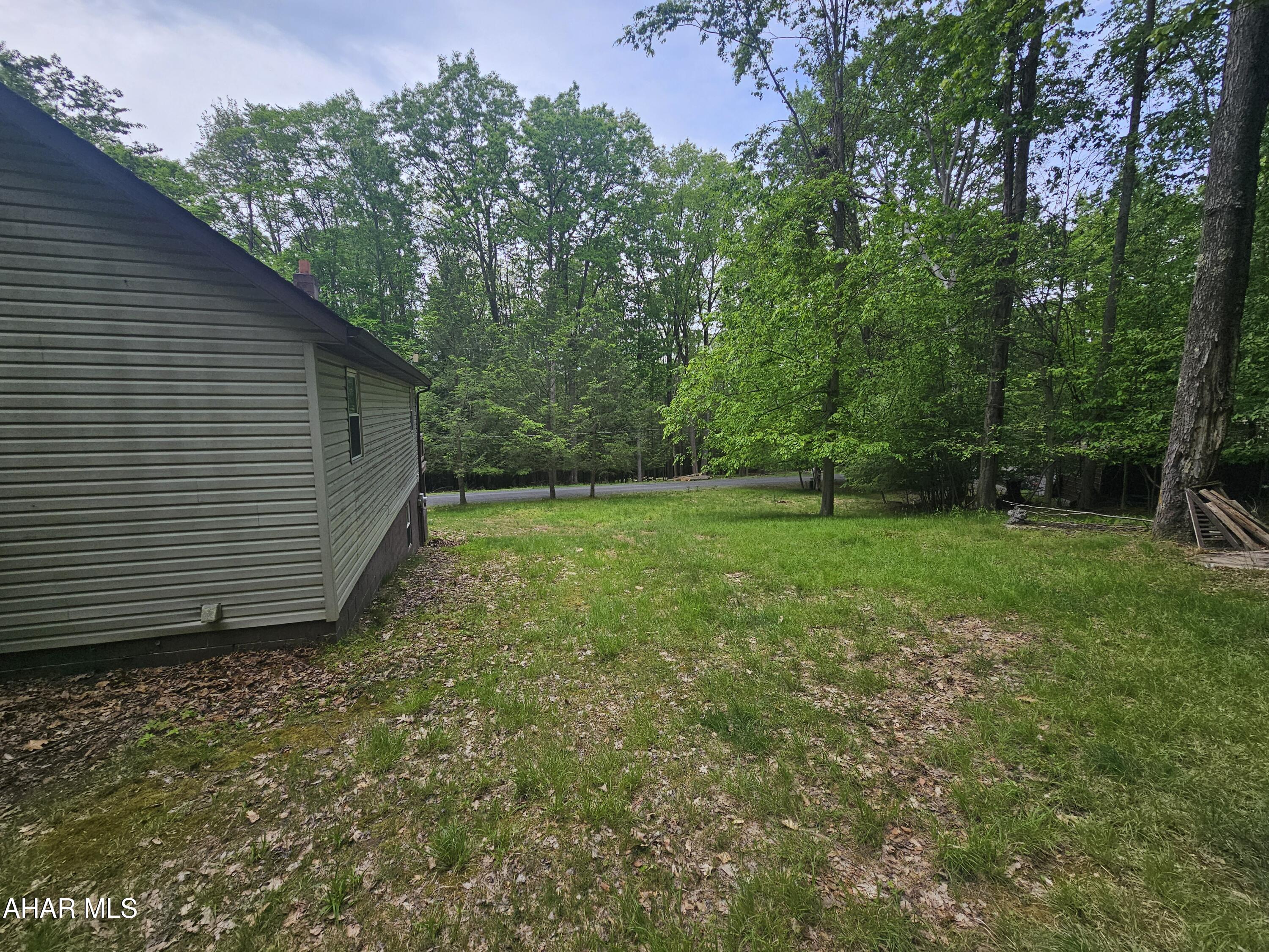 207 Kendrick Lane Flinton, PA 16640 - Photo 6 of 30 a view of a backyard with a garden