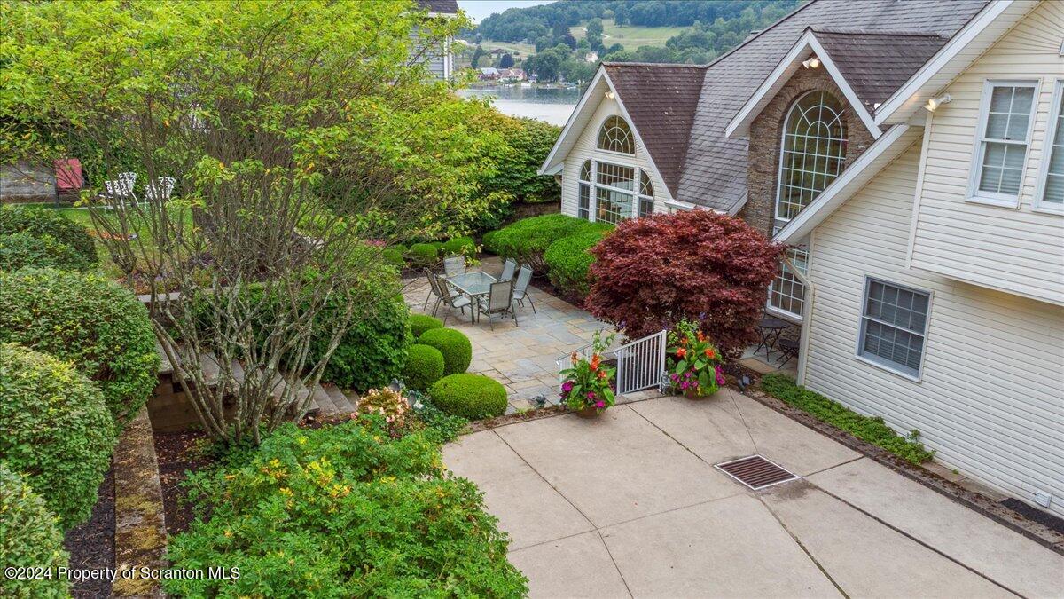 218 Point Road Lake Winola, PA 18419 - Photo 20 of 65 a front view of a house with a garden