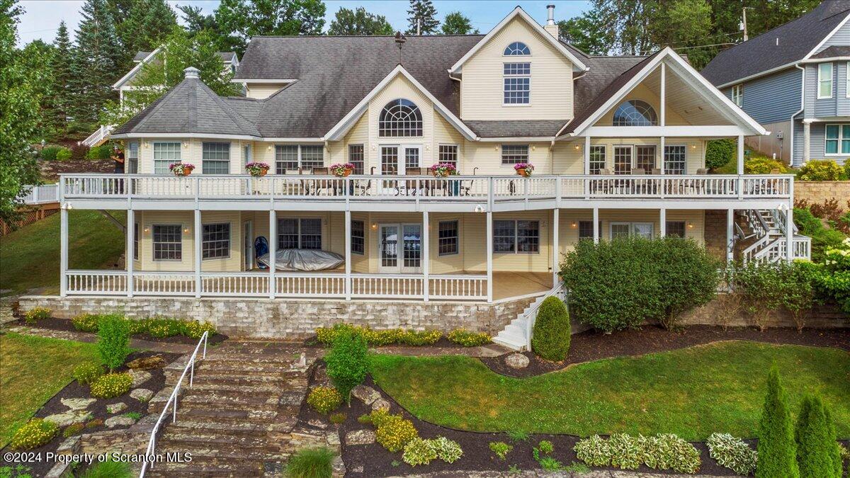 218 Point Road Lake Winola, PA 18419 - Photo 2 of 65 a front view of a house with a yard