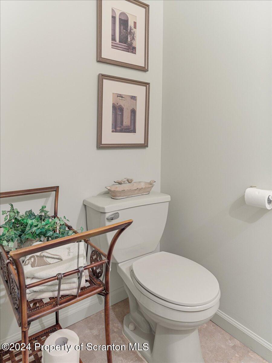 218 Point Road Lake Winola, PA 18419 - Photo 34 of 65 a white toilet sitting next to a bathroom sink