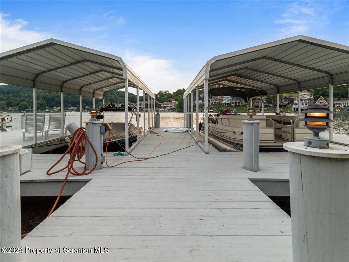 218 Point Road Lake Winola, PA 18419 - Photo 38 of 65 a view of a patio with table and chairs under an umbrella
