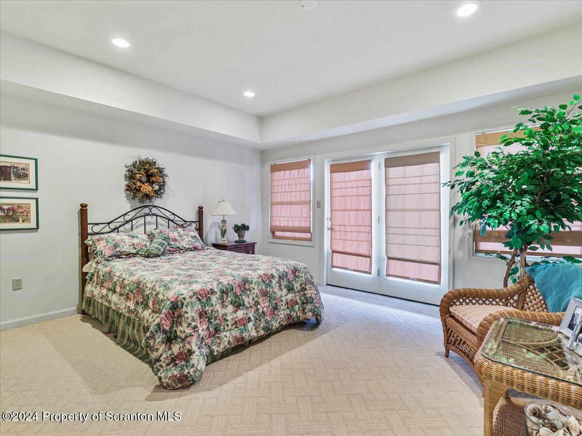 218 Point Road Lake Winola, PA 18419 - Photo 45 of 65 a bedroom with a bed and a couch