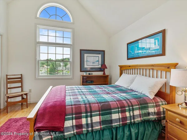 a bedroom with a bed and a couch