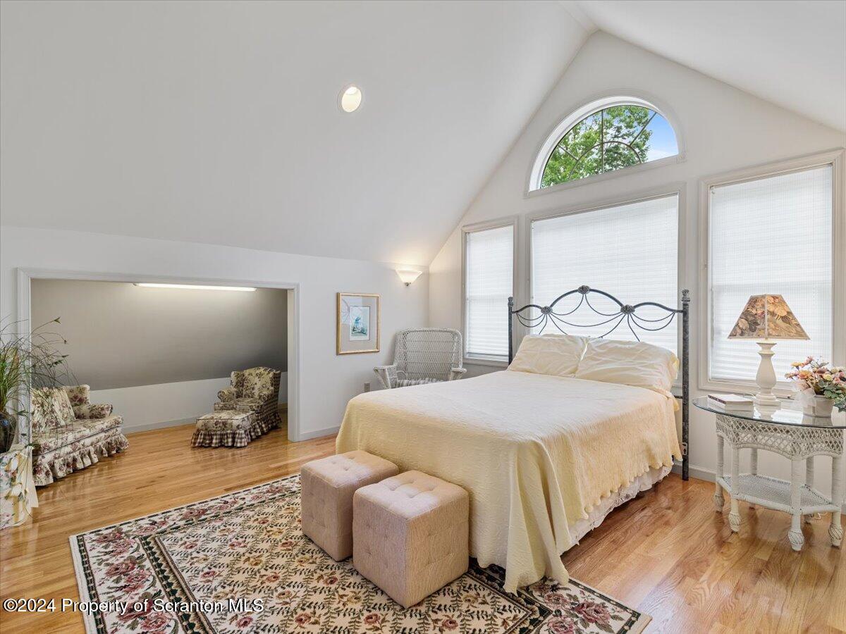 218 Point Road Lake Winola, PA 18419 - Photo 50 of 65 a bedroom with a bed and wooden floor