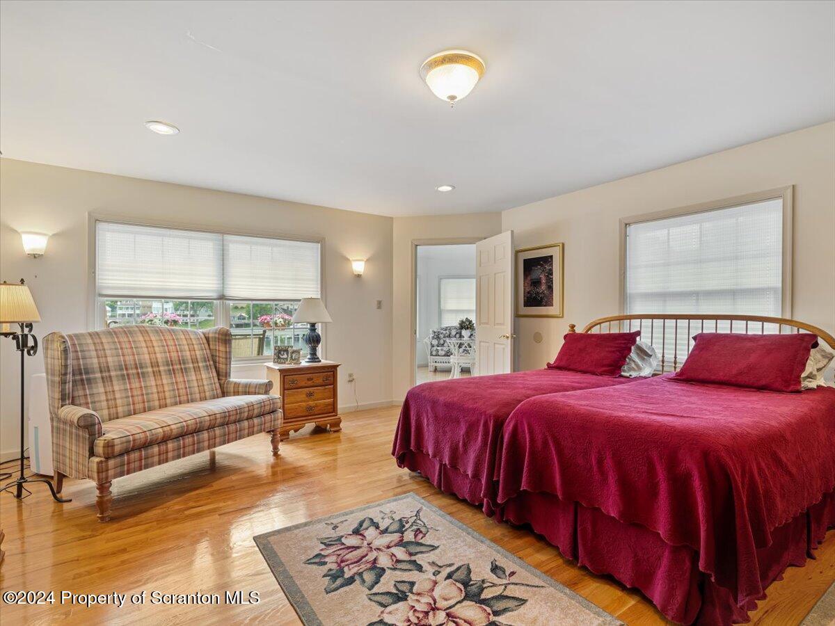218 Point Road Lake Winola, PA 18419 - Photo 54 of 65 a bedroom with a bed and a couch