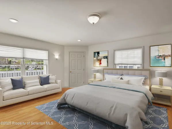 a bedroom with a bed and a couch with window