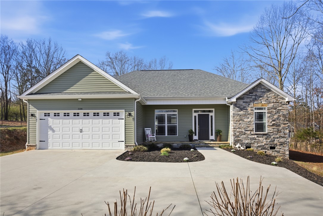 This charming home offers a perfect blend of modern comfort and natural beauty.