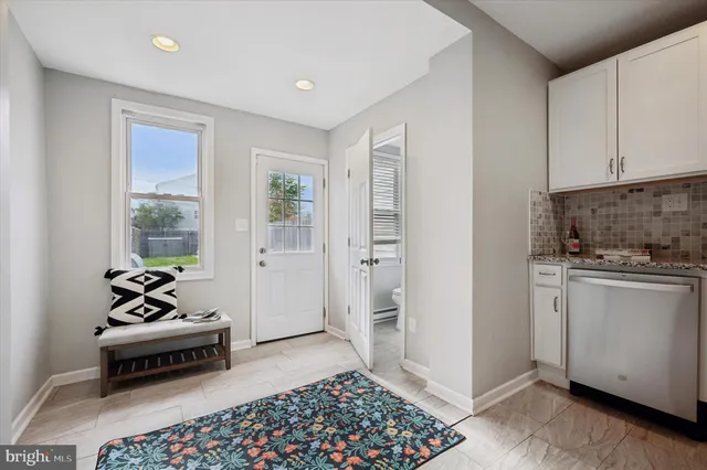 a bedroom with furniture and window