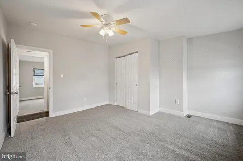 an empty room with a bathroom